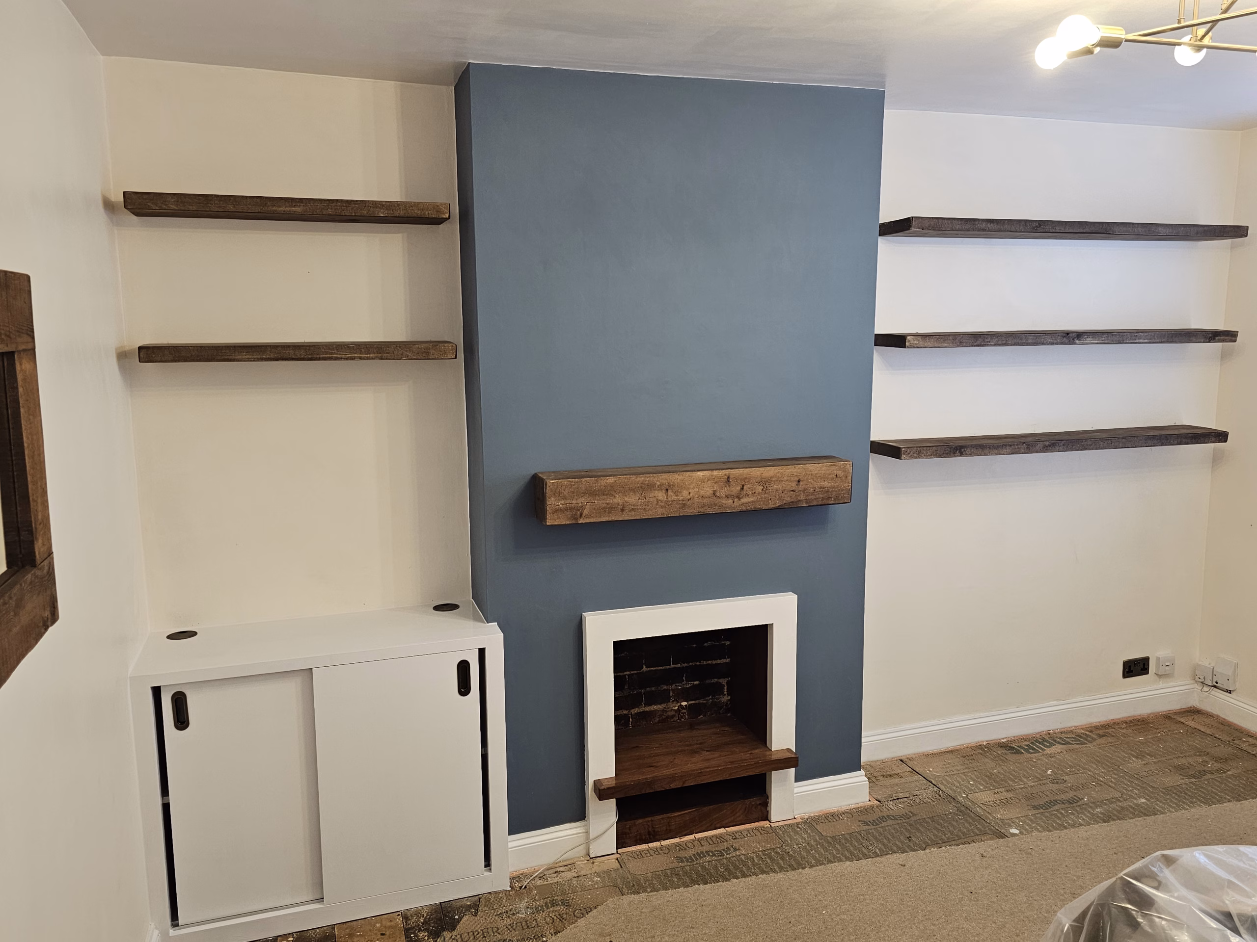 Alcove cupboard and floating shelves